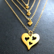 gold Mother 3 daughters necklace, three heart cutout charm - RayK designs